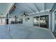 Covered patio with ceiling fans and multiple glass sliding door entrances at 4704 Shale Pl, Tampa, FL 33615