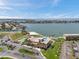 An aerial view features the building, waterfront, and community amenities with a clear, blue sky at 4900 Brittany S Dr # 805, St Petersburg, FL 33715