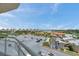 Balcony view overlooking lush landscaping and parking at 4900 Brittany S Dr # 805, St Petersburg, FL 33715