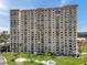 High-rise building featuring multiple balconies, surrounded by well-manicured green spaces at 4900 Brittany S Dr # 805, St Petersburg, FL 33715