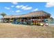A waterside community kayak storage rack filled with brightly colored kayaks on a sunny day at 4900 Brittany S Dr # 805, St Petersburg, FL 33715