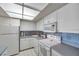 Well-lit kitchen with white cabinetry, light countertops, and modern appliances at 4900 Brittany S Dr # 805, St Petersburg, FL 33715