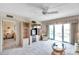Comfortable living room with entertainment center, slider to the balcony, and view of the adjacent bedroom at 4900 Brittany S Dr # 805, St Petersburg, FL 33715