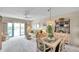 Bright living and dining area with slider to the balcony and comfortable furnishings at 4900 Brittany S Dr # 805, St Petersburg, FL 33715