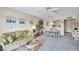 Cozy living room with couch and adjacent dining area at 4900 Brittany S Dr # 805, St Petersburg, FL 33715