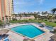 A sparkling community pool with lounge chairs and well-maintained landscaping offer a relaxing outdoor retreat at 4900 Brittany S Dr # 805, St Petersburg, FL 33715