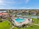Inviting community pool surrounded by lush landscaping, offering a tranquil waterfront atmosphere at 4900 Brittany S Dr # 805, St Petersburg, FL 33715