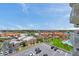 Picturesque view of the community with a parking lot, a lush green lawn and lake views at 4900 Brittany S Dr # 805, St Petersburg, FL 33715