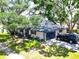 Spacious single-story house with a two-car garage and a basketball hoop in the driveway at 5021 Roanoke Dr, Holiday, FL 34690