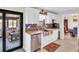 Updated kitchen boasts stainless steel appliances, granite counters, and a view to the screened-in patio at 5021 Roanoke Dr, Holiday, FL 34690