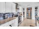 Updated kitchen boasts stainless appliances, granite counters, stylish backsplash, and ample cabinet space at 5021 Roanoke Dr, Holiday, FL 34690