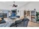 Spacious living room featuring a stone fireplace, built-in shelving, and backyard access at 5021 Roanoke Dr, Holiday, FL 34690