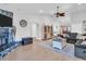 Cozy living room with stone fireplace, vaulted ceilings, and tiled floors at 5021 Roanoke Dr, Holiday, FL 34690