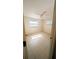 Bedroom with tiled floor, ceiling fan, and two windows at 5122 Dove Dr, New Port Richey, FL 34652