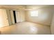Bedroom features a closet, ceiling fan and window at 5122 Dove Dr, New Port Richey, FL 34652