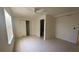 Well-lit bedroom featuring tile floors, closet space, and a modern ceiling fan at 5122 Dove Dr, New Port Richey, FL 34652
