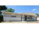 Inviting front view of a single-story home, featuring a cozy covered entryway at 5122 Dove Dr, New Port Richey, FL 34652