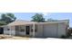 Charming single-story home with a covered porch and attached one-car garage at 5122 Dove Dr, New Port Richey, FL 34652