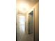 Hallway leading to bedrooms and bathrooms with tile flooring at 5122 Dove Dr, New Port Richey, FL 34652