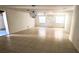 Spacious living room filled with natural light and adorned with tile flooring at 5122 Dove Dr, New Port Richey, FL 34652