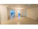 Bright and open living space connecting to kitchen, boasting tile floors and ample lighting at 5122 Dove Dr, New Port Richey, FL 34652
