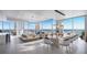 Bright, modern living area with floor-to-ceiling windows offering panoramic city views, stylish furniture, and contemporary design at 520 N Tampa St # 4201, Tampa, FL 33602