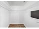 Spacious walk-in closet with wire shelving and wood-look flooring at 6439 Cypressdale Dr # 101, Riverview, FL 33578
