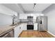 Modern kitchen features stainless steel appliances and granite countertops at 6439 Cypressdale Dr # 101, Riverview, FL 33578