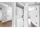 Hallway view of stackable washer and dryer unit in closet at 6439 Cypressdale Dr # 101, Riverview, FL 33578