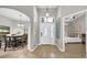 Welcoming entryway with a view of the dining area and bedroom, showcasing open floor plan at 650 Arbor Ln, Largo, FL 33770