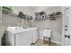 The laundry room features a washer, dryer, utility sink, and ample storage at 650 Arbor Ln, Largo, FL 33770