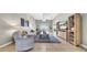 Open-concept living room boasting tile floors, neutral colors, and a seamless flow to the outdoors at 650 Arbor Ln, Largo, FL 33770