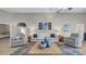 Comfortable living area featuring tile floors, stylish decor, and plenty of natural light at 650 Arbor Ln, Largo, FL 33770