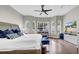 A well-lit main bedroom boasts a large window and an entertainment center with a flat screen TV at 650 Arbor Ln, Largo, FL 33770