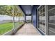 View of a table and chairs on the screened in back patio at 650 Arbor Ln, Largo, FL 33770