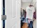 Walk-in closet with custom organization system featuring shelves, drawers and racks for hanging clothes at 650 Arbor Ln, Largo, FL 33770