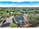 Aerial view of home featuring patio and playground surrounded by many trees at 6526 Summer Cove Dr, Riverview, FL 33578