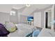 Bedroom featuring a comfortable bed, TV, and a window with natural light at 6526 Summer Cove Dr, Riverview, FL 33578