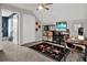 Bedroom with ceiling fan, closet, work space, and a geometric patterned rug at 6526 Summer Cove Dr, Riverview, FL 33578