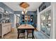 Inviting dining room with stylish lighting, a display cabinet, and a sliding door to the backyard at 6526 Summer Cove Dr, Riverview, FL 33578