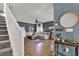 Spacious living room with cozy sectional sofa, ceiling fan, and stairs in view at 6526 Summer Cove Dr, Riverview, FL 33578