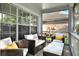 Inviting screened porch with comfortable seating, perfect for relaxation and enjoying the outdoors at 6526 Summer Cove Dr, Riverview, FL 33578