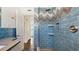 Step-in shower with designer tile work, modern fixtures, and glass door at 6700 Sunset Way # 206, St Pete Beach, FL 33706