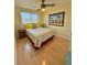 Well-lit bedroom with ceiling fan and bright yellow walls and furnishings at 6700 Sunset Way # 206, St Pete Beach, FL 33706