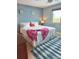 Comfortable bedroom with beach-themed decor, a queen-sized bed, and plenty of natural light at 6700 Sunset Way # 206, St Pete Beach, FL 33706