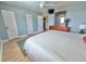 Bedroom with two doors, a dresser, a view and a ceiling fan at 6700 Sunset Way # 206, St Pete Beach, FL 33706