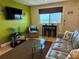 Cozy living room featuring seating, a view of the beach, and modern decor at 6700 Sunset Way # 206, St Pete Beach, FL 33706
