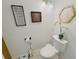A clean bathroom with a toilet, sink, and vanity at 701 S Madison Ave # 414, Clearwater, FL 33756