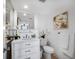 Bright white bathroom with white cabinetry and vanity at 701 S Madison Ave # 414, Clearwater, FL 33756