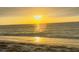 Beautiful beach with the sun reflecting on the water at sunset at 701 S Madison Ave # 414, Clearwater, FL 33756
